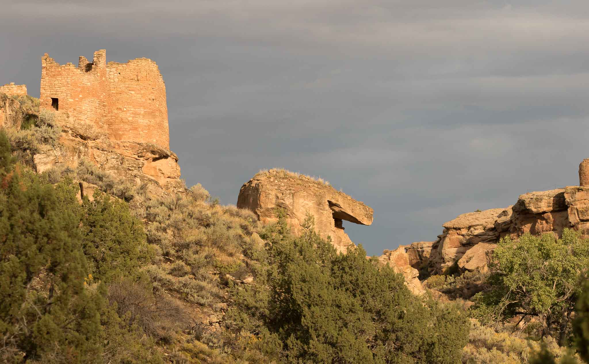 Twin Towers and Eroded Boulder House lit by the rising sun after a rainy night, Hovenweep National Monument, Aneth UT, September 30, 2016