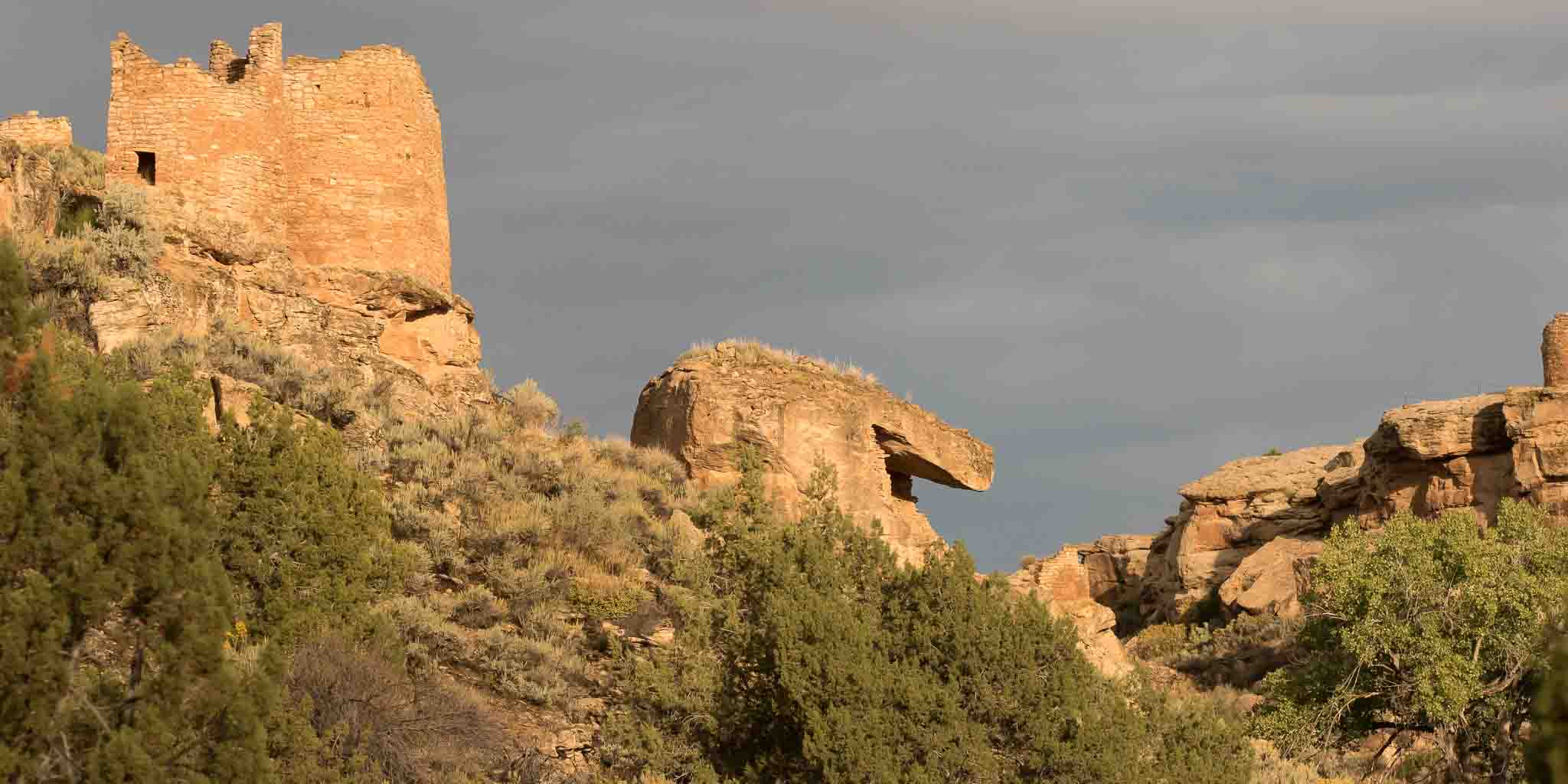 Twin Towers and Eroded Boulder House lit by the rising sun after a rainy night, Hovenweep National Monument, Aneth UT, September 30, 2016