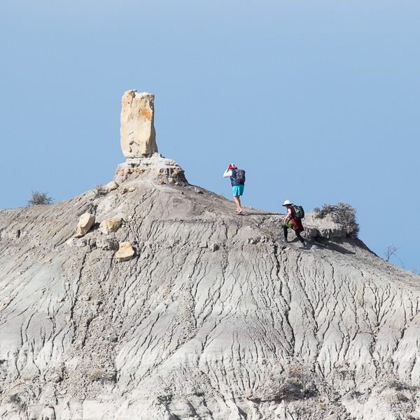 Hikers on the ridge in front of Angel Peak, Bloomfield NM, October 19, 2015