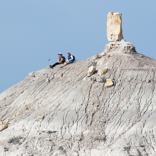 Hikers on the ridge in front of Angel Peak, Bloomfield NM, October 19, 2015